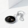 Get Away Crew Travel Keyring Tag — Round Metal Keychain with TGAO Logo