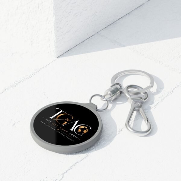 Get Away Crew Travel Keyring Tag — Round Metal Keychain with TGAO Logo